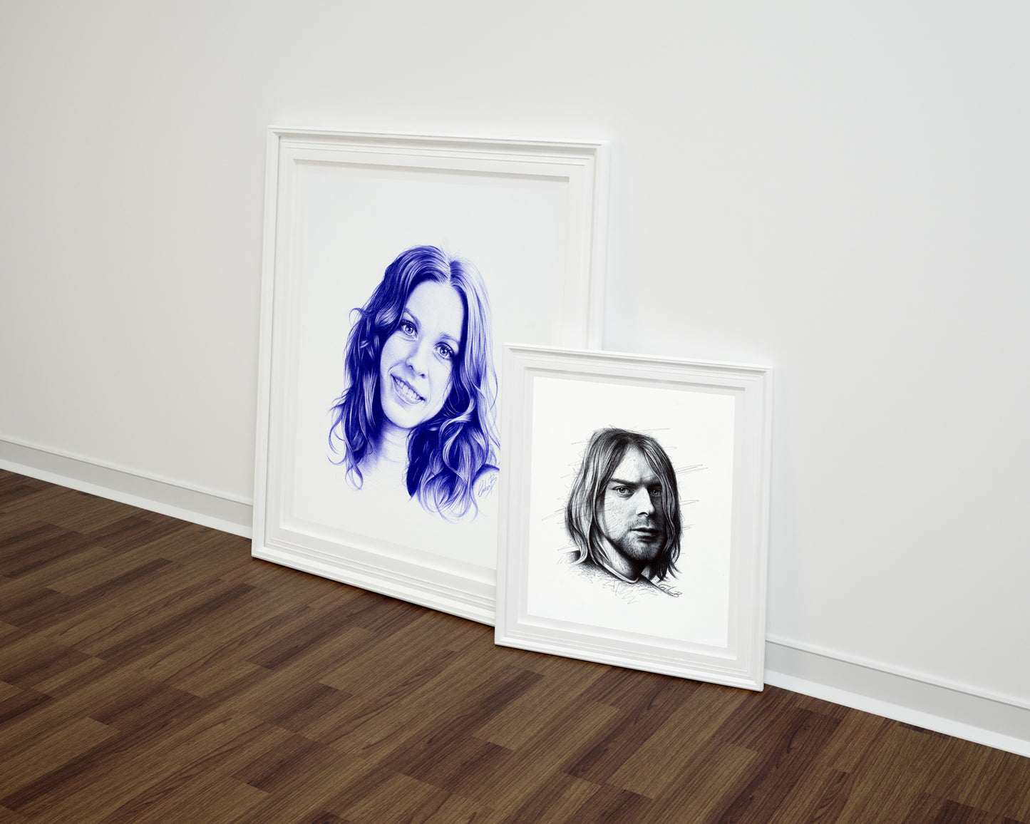 Showcasing an art print of Kurt Cobain and Alanis Morissette by Graham Bradshaw hanging on a wall.